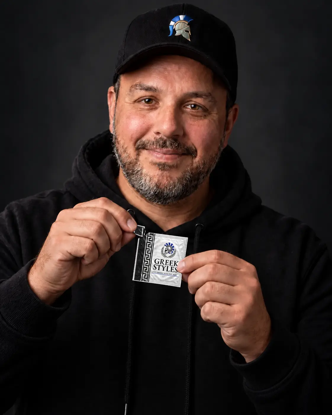 Greek Styles founder George Lalakidis opening a Spartan XL wrapper